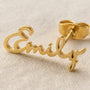 Close-up of custom name lettering on earring