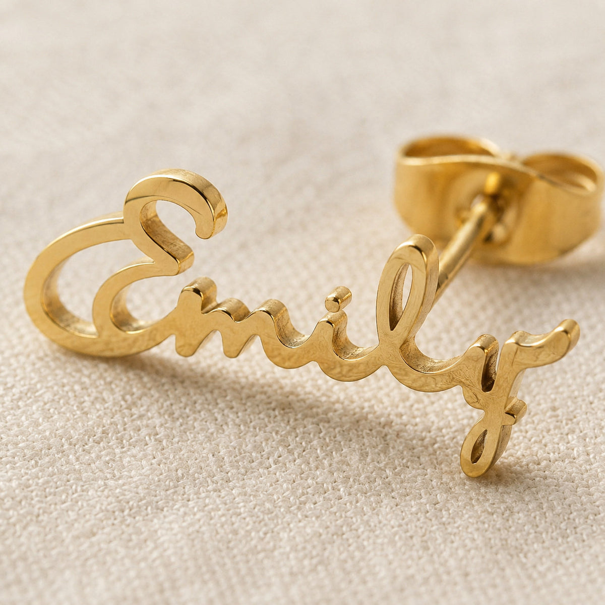 Close-up of custom name lettering on earring