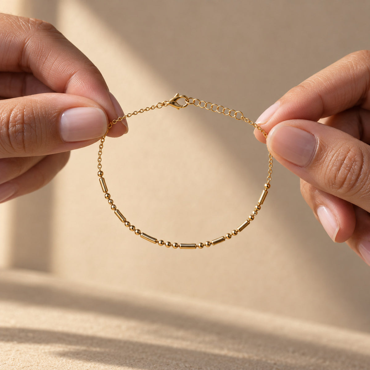 Morse Code Bracelet held between fingers