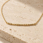 Close-up of Morse code beads on necklace