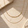 Morse Code Necklace layered with another chain