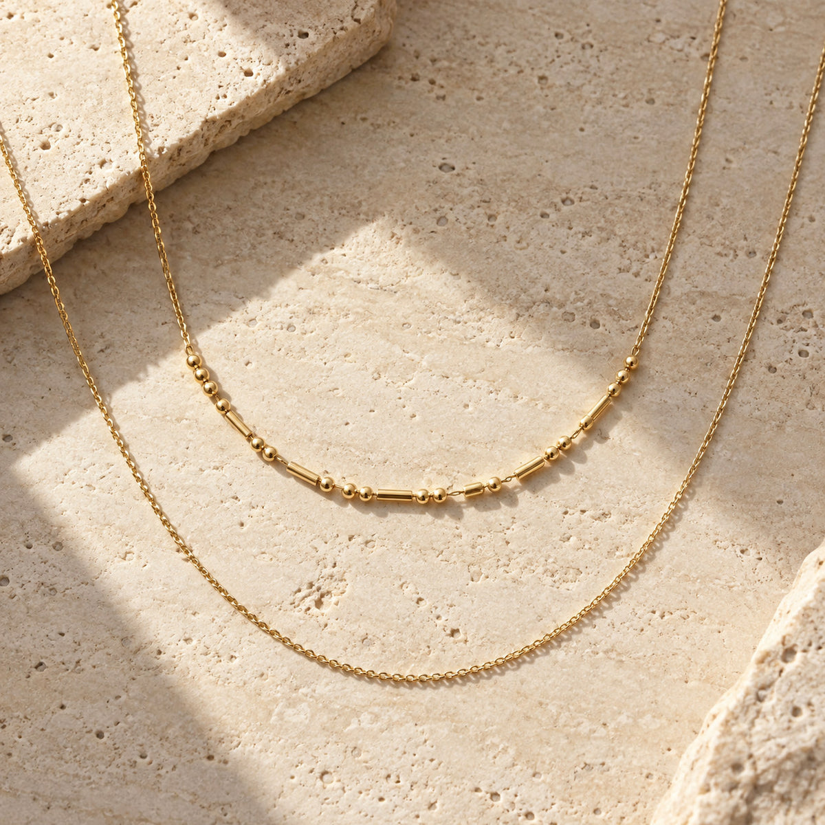 Morse Code Necklace layered with another chain
