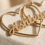 Close-up of custom name lettering on heart necklace