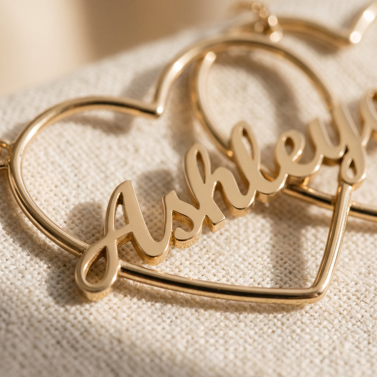 Close-up of custom name lettering on heart necklace
