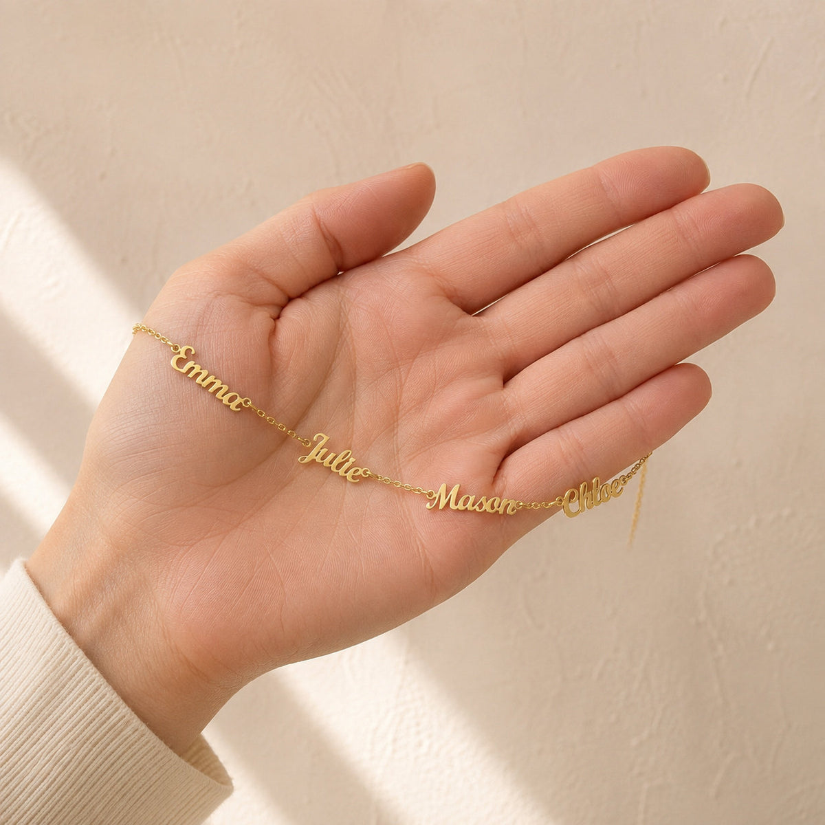 Personalized Name Necklace draped across the hand